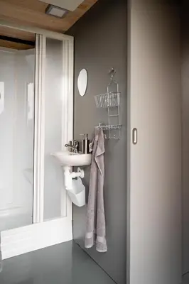 a bathroom with a sink and a mirror at Tiny House Sedla in Velká