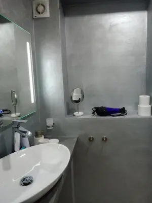 a bathroom with a white sink and a mirror at Apartmán Maria in Litoměřice