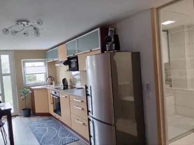 a kitchen with a stainless steel refrigerator at Apartmán Maria in Litoměřice