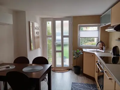 a kitchen with a table and a dining room at Apartmán Maria in Litoměřice