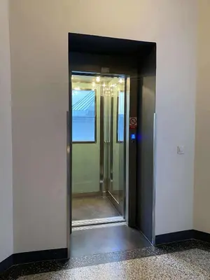 a hallway with a door leading into a building at Cozy Luxe Home at the Heart of Old Prague Centre in Prague