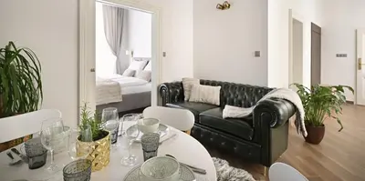 a bathroom with a white sink and a toilet at Kaiserstein Palace Apartments in Prague