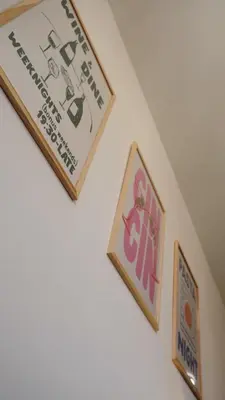 a pair of signs on a wall next to a wall at Modern apartment in Zizkov 10 min from Wenceslav Square in Prague