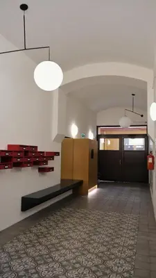 an empty room with a bench and a door at Modern apartment in Zizkov 10 min from Wenceslav Square in Prague