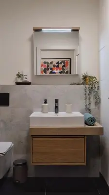 a bathroom with a sink and a mirror at Modern apartment in Zizkov 10 min from Wenceslav Square in Prague
