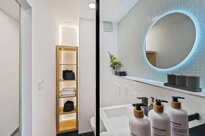 a bathroom with a sink and a mirror at Boutique apartment Záhřebská in Prague