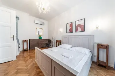 a bedroom with a large bed in a room at Dušní Street Gem in Prague