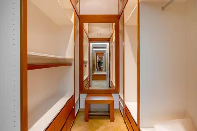 a dressing room with a mirror and a stool at Bright OldTown 2bdr apartment in Prague