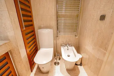 a bathroom with a toilet and a sink at Bright OldTown 2bdr apartment in Prague