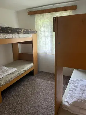 a room with two bunk beds and a window at Kolečko in Křivoklát