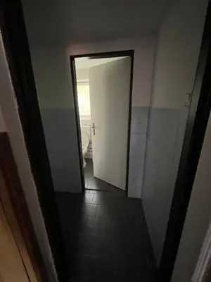 a hallway with a door leading to a bathroom at Kolečko in Křivoklát