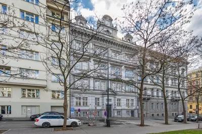 a white car parked in front of a building at HOMELY I Central 38m2 APT I ELEVATOR I Self Check-In in Prague