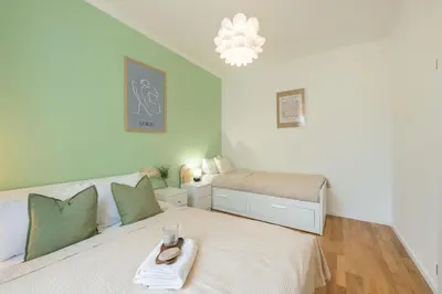 a white bedroom with a bed at HOMELY I Central 38m2 APT I ELEVATOR I Self Check-In in Prague
