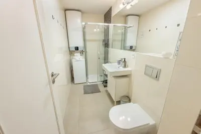 a bathroom with a toilet and a sink at HOMELY I Central 38m2 APT I ELEVATOR I Self Check-In in Prague