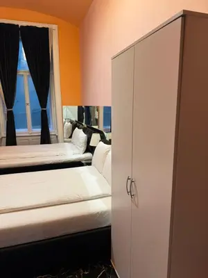 a bedroom with two beds and a window at VIP 1-Wenceslas square in Prague