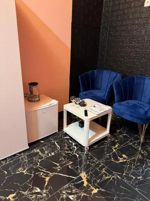 two blue chairs and a table in a room at VIP 1-Wenceslas square in Prague