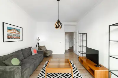 a living room with a couch and a coffee table at Tram Depot Loft in Prague