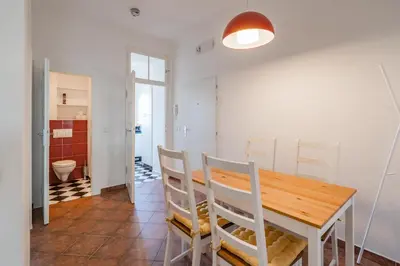 a dining room with a wooden table and chairs at Tram Depot Loft in Prague