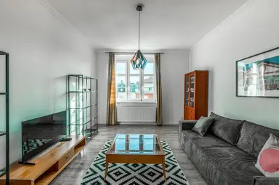 a living room with a couch and a coffee table at Tram Depot Loft in Prague