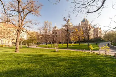 a park in front of a large building at Museum Garden Stay in Prague