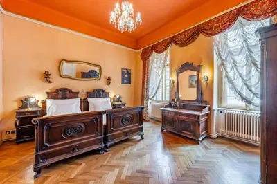a bedroom with two beds and a mirror at Baroque Grand Apartment XXL - City Center - 160 m2 in Prague