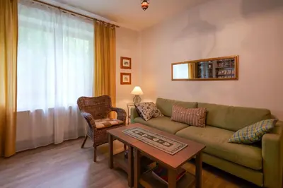 a living room with a couch and a table at Beautiful house by the river with its own dock in Rabyně