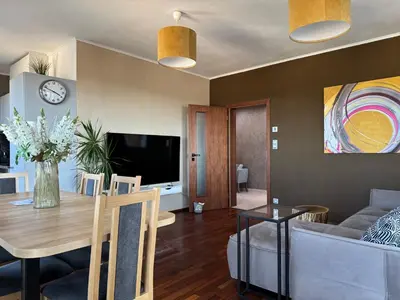 a living room with a table and a couch at Old town view BOUTIQUE APARTMENT with FREE PARKING in Prague