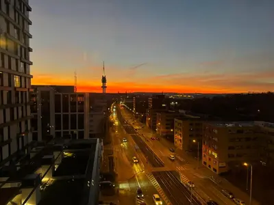 a view of a city street with traffic at sunset at Old town view BOUTIQUE APARTMENT with FREE PARKING in Prague