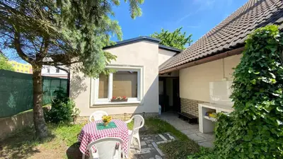 a table and chairs in the backyard of a house at ALEX-ASIE-EU penzion in Unhošť