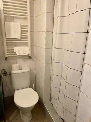 a bedroom with two beds and a window at PodPrahou - Na Petynce in Prague