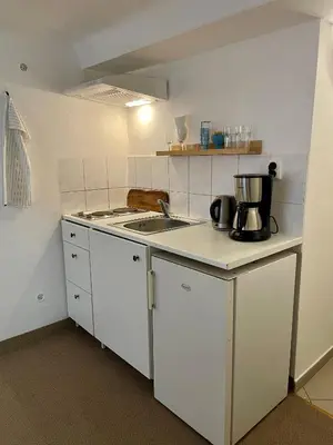 a bathroom with a sink and a mirror and towels at PodPrahou - Na Petynce in Prague