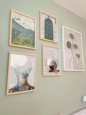 a group of pictures on a wall at True Relax Apartman 2 bedrooms Wenceslas square in Prague