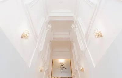 a hallway in a building with white ceilings at True Relax Apartman 2 bedrooms Wenceslas square in Prague