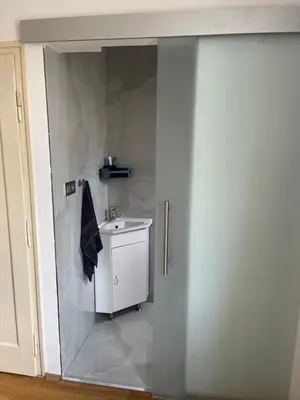 a bathroom with a white sink in a room at myPoděbrady apartment in Poděbrady