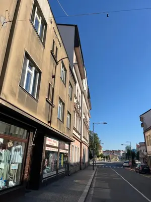 an empty street with a building on the side of the road at myPoděbrady apartment in Poděbrady