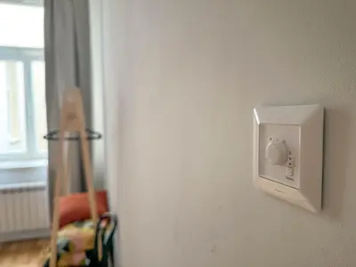 a room with a white microwave on a wall at Elegant Apartment Near Main Station & Wenceslas Sq in Prague