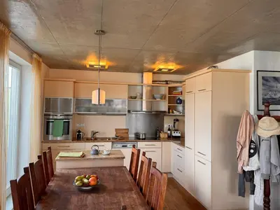 a kitchen with a table with a bowl of fruit on it at LOcelot Premium 2 floor Apartment near O2 Arena in Prague