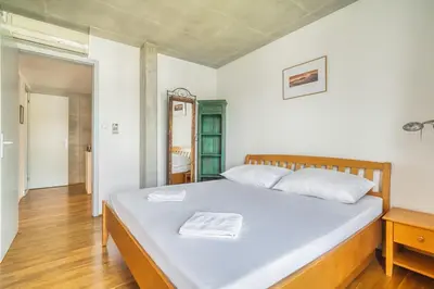 a bedroom with a bed with two towels on it at LOcelot Premium 2 floor Apartment near O2 Arena in Prague