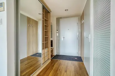 a hallway with a glass door leading to a closet at LOcelot Premium 2 floor Apartment near O2 Arena in Prague