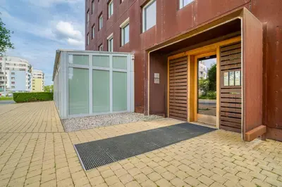 a building with a large door on the side of it at LOcelot Premium 2 floor Apartment near O2 Arena in Prague