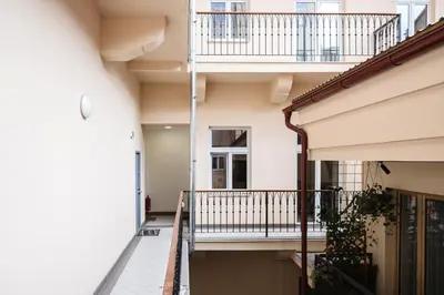 a hallway of a house with a balcony at Prague Days - One-bedroom Apartment with Netflix and High Speed WiFi in Karlín in Prague