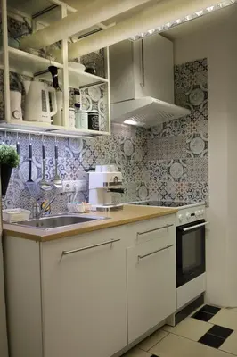 a kitchen with white cabinets and a sink at Chill Vibes Netflix, PS5 & Free Parking! in Prague
