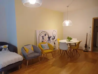 a bathroom with a white sink and a mirror at 10min to the center Modern Flat in Prague