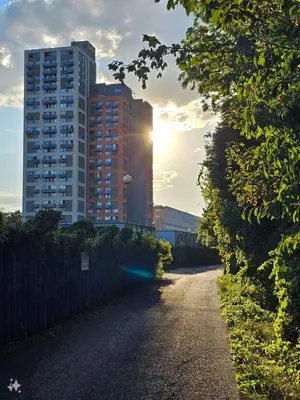 a dirt road with a building in the background at Apartmán ELEN, Sky View in Prague