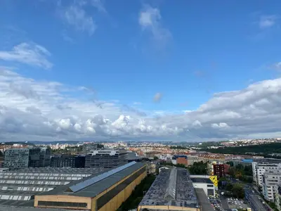 a refrigerator is sitting in an office at Apartmán ELEN, Sky View in Prague