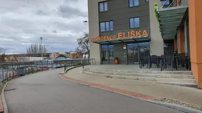 a building with a table and chairs in front of it at Apartmán ELEN, Sky View in Prague
