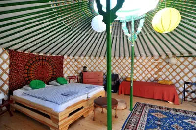 a bedroom with a bed in a yurt at Idyllic Yurt with Organic Fruit Garden near Cesky Brod, Czech Republic in Český Brod