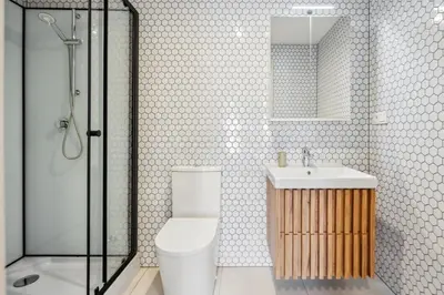 a bathroom with a toilet and a sink and a shower at Spacious two-storey apartment with a terrace in the city center in Benešov