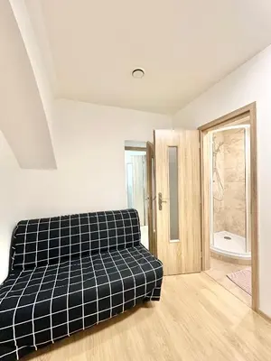 a bedroom with a bed and a bathroom at The Little Peaceful Retreat Near Center in Prague