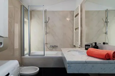a bathroom with a tub and a toilet and a sink at Deluxe Rabbit Suite in Prague